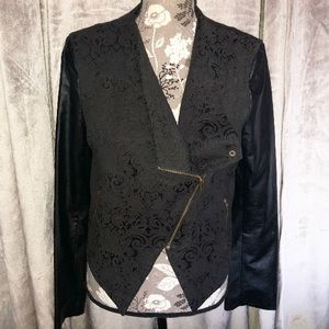 Black leather jacket with printed detail.